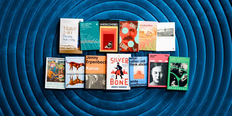 The International Booker Prize longlist books photographed from above.